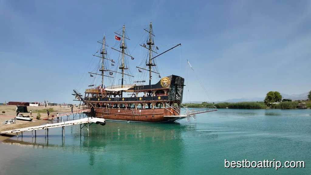 Traditional pirate boat anchored on turquoise Manavgat River